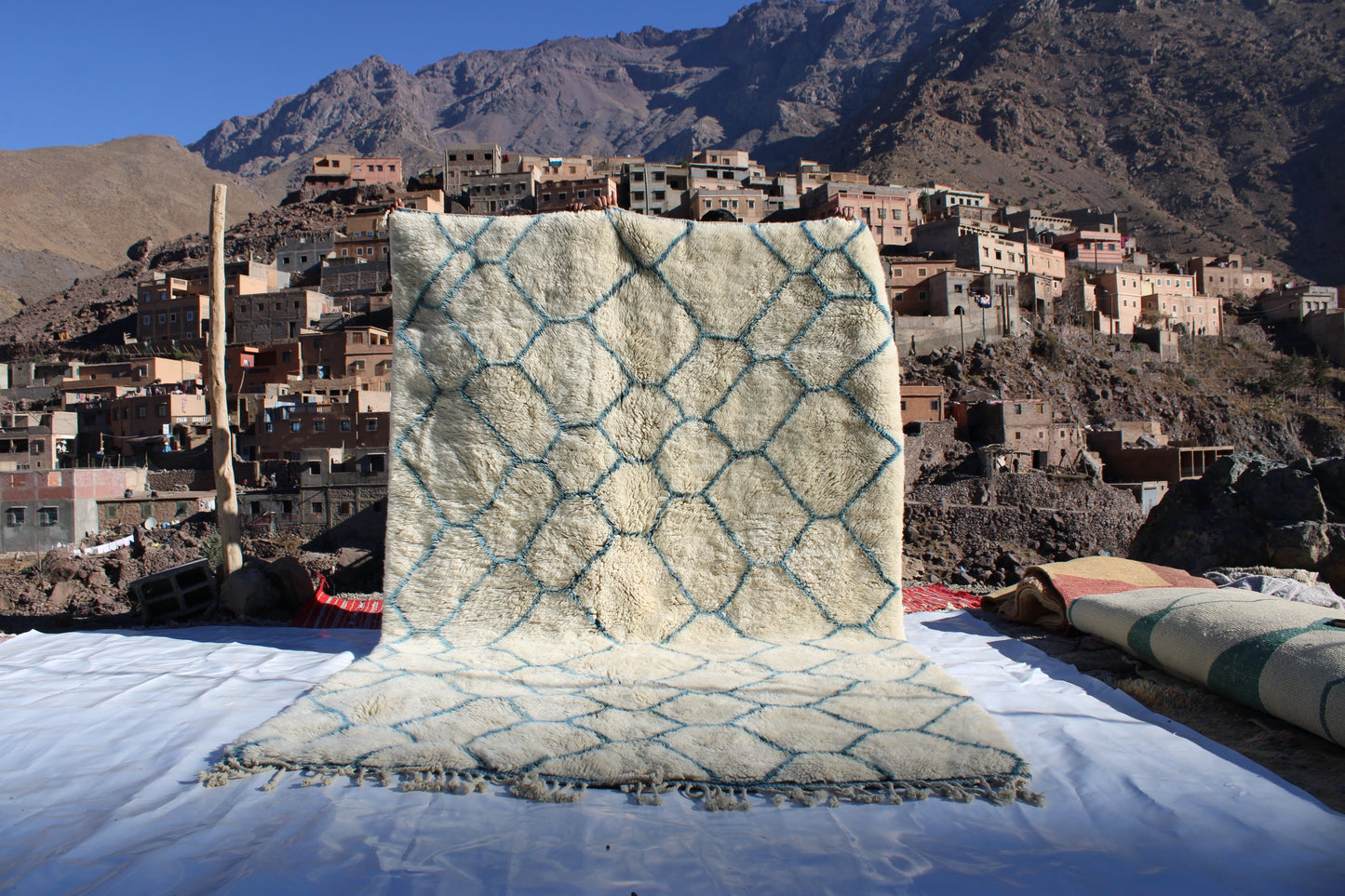 Beni Ourain rugs originate from the Atlas Mountains of Morocco and are characterized by their distinctive, neutral-toned, and geometric designs. These handwoven rugs often feature a plush pile and are made by the Berber tribes,  size is 280x177 cm